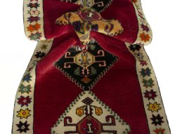 Corner detail of 2000s Persian Gabbeh rug showing border pattern and Wool pile