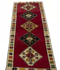 Surface texture of 2000s Persian Gabbeh rug with natural Wool and intricate pattern