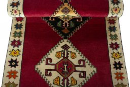 Full view of 2000s Persian Gabbeh rug from Iran / Persia, 181 × 71 cm in Red tones