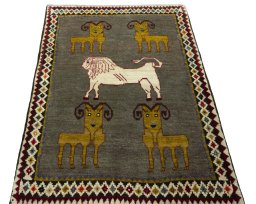Surface texture of 2000s Persian Gabbeh rug with natural Wool and intricate pattern