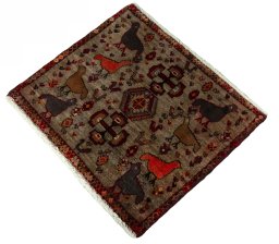 Corner detail of 2000s Persian Gabbeh rug showing border pattern and Wool pile