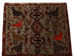 Surface texture of 2000s Persian Gabbeh rug with natural Wool and intricate pattern