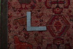 Backside of handmade 2000s Persian Gabbeh rug showing knot structure and weave density