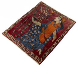 Corner detail of 2000s Persian Gabbeh rug showing border pattern and Wool pile