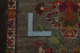 Backside of handmade 2000s Persian Gabbeh rug showing knot structure and weave density