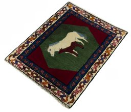 Corner detail of 2000s Persian Gabbeh rug showing border pattern and Wool pile