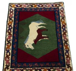 Surface texture of 2000s Persian Gabbeh rug with natural Wool and intricate pattern