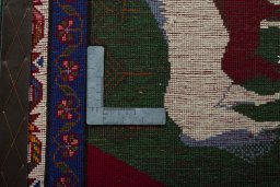 Backside of handmade 2000s Persian Gabbeh rug showing knot structure and weave density
