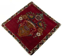 Corner detail of 2000s Persian Gabbeh rug showing border pattern and Wool pile