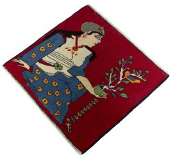 Corner detail of 2000s Persian Gabbeh rug showing border pattern and Wool pile