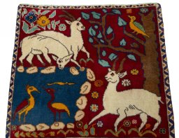 Surface texture of 2000s Persian Gabbeh rug with natural Wool and intricate pattern