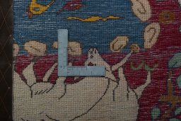 Backside of handmade 2000s Persian Gabbeh rug showing knot structure and weave density
