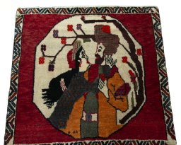 Surface texture of 2000s Persian Gabbeh rug with natural Wool and intricate pattern