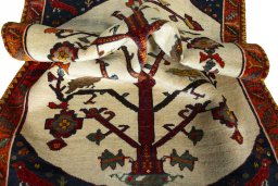 Corner detail of 2000s Persian Gabbeh rug showing border pattern and Wool pile