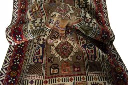 Corner detail of 2000s Persian Gabbeh rug showing border pattern and Wool pile
