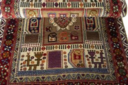 Full view of 2000s Persian Gabbeh rug from Iran / Persia, 185 × 106 cm in Beige tones