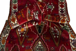 Corner detail of 2000s Persian Gabbeh rug showing border pattern and Wool pile