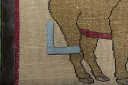 Corner detail of 2000s Persian Gabbeh rug showing border pattern and Wool pile