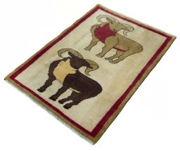 Corner detail of 2000s Persian Gabbeh rug showing border pattern and Wool pile