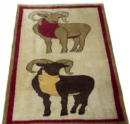 Surface texture of 2000s Persian Gabbeh rug with natural Wool and intricate pattern