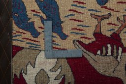 Backside of handmade 2000s Persian Gabbeh rug showing knot structure and weave density