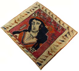 Corner detail of 2000s Persian Gabbeh rug showing border pattern and Wool pile