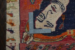 Backside of handmade 2000s Persian Gabbeh rug showing knot structure and weave density