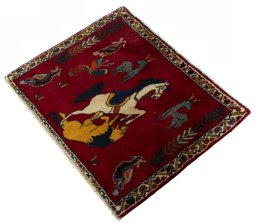 Corner detail of 2000s Persian Gabbeh rug showing border pattern and Wool pile