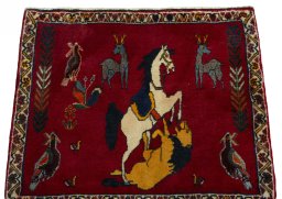 Surface texture of 2000s Persian Gabbeh rug with natural Wool and intricate pattern