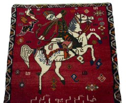 Surface texture of 2000s Persian Gabbeh rug with natural Wool and intricate pattern