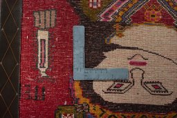 Backside of handmade 2000s Persian Gabbeh rug showing knot structure and weave density