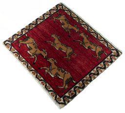 Corner detail of 2000s Persian Gabbeh rug showing border pattern and Wool pile
