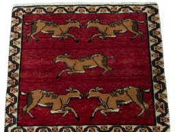 Surface texture of 2000s Persian Gabbeh rug with natural Wool and intricate pattern