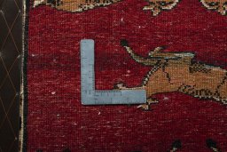 Backside of handmade 2000s Persian Gabbeh rug showing knot structure and weave density