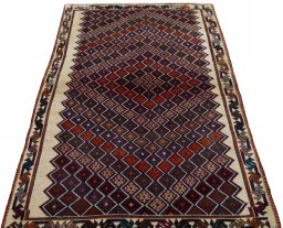 Surface texture of 2000s Persian Gabbeh rug with natural Wool and intricate pattern