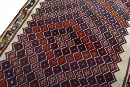 Backside of handmade 2000s Persian Gabbeh rug showing knot structure and weave density