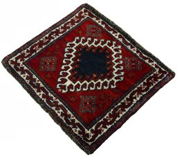Corner detail of 2000s Persian Gabbeh rug showing border pattern and Wool pile