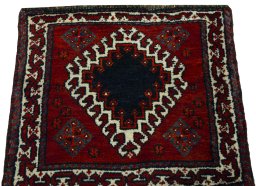 Surface texture of 2000s Persian Gabbeh rug with natural Wool and intricate pattern