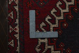 Backside of handmade 2000s Persian Gabbeh rug showing knot structure and weave density