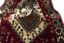 Corner detail of 2000s Persian Gabbeh rug showing border pattern and Wool pile
