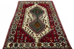 Surface texture of 2000s Persian Gabbeh rug with natural Wool and intricate pattern