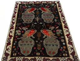 Surface texture of 2000s Persian Gabbeh rug with natural Wool and intricate pattern