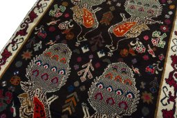 Backside of handmade 2000s Persian Gabbeh rug showing knot structure and weave density