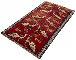 Corner detail of 2000s Persian Gabbeh rug showing border pattern and Wool pile
