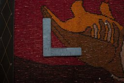 Backside of handmade 2000s Persian Gabbeh rug showing knot structure and weave density