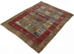 Corner detail of 2000s Persian Gabbeh rug showing border pattern and Wool pile