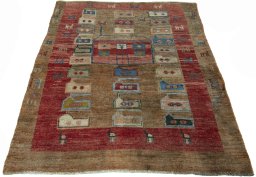 Surface texture of 2000s Persian Gabbeh rug with natural Wool and intricate pattern