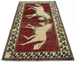 Surface texture of 2000s Persian Gabbeh rug with natural Wool and intricate pattern
