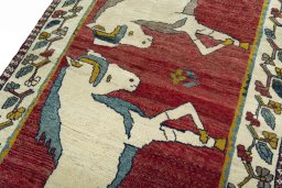 Backside of handmade 2000s Persian Gabbeh rug showing knot structure and weave density