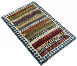 Close-up detail of 2000s Persian Gabbeh rug from Iran / Persia showing Wool weave